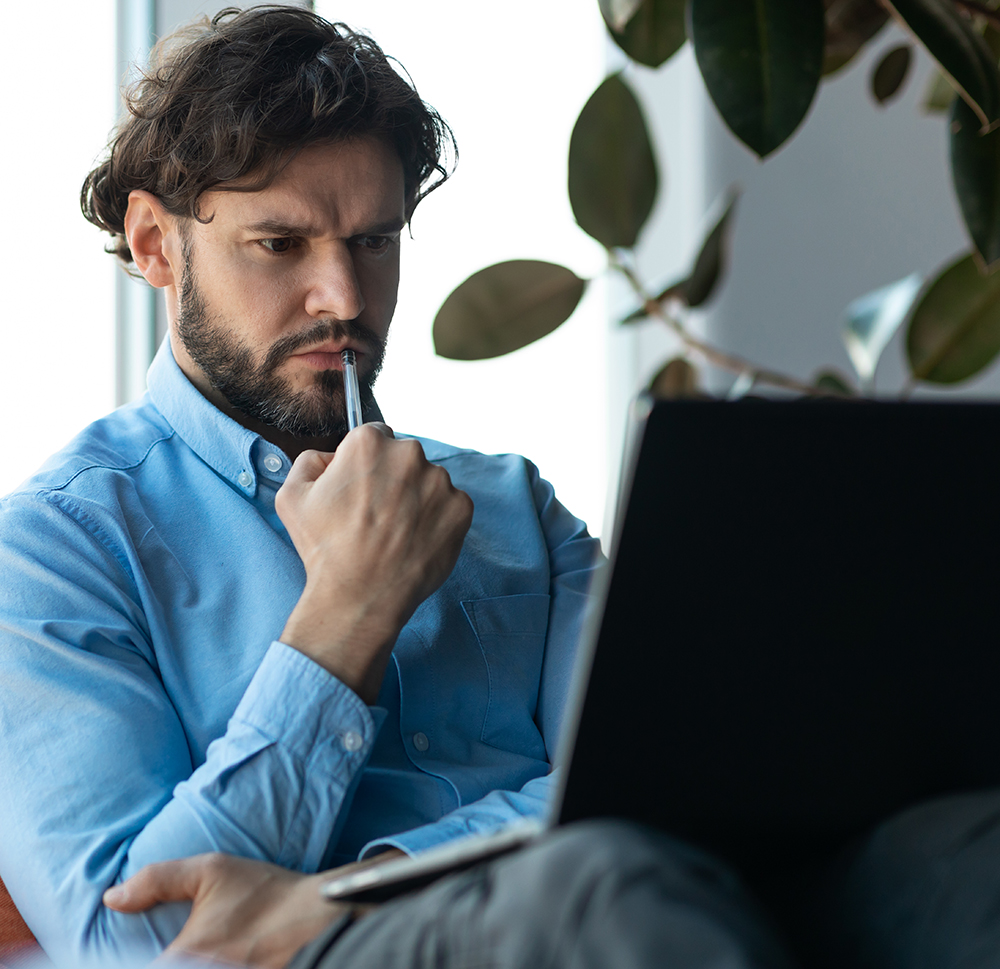 man thinking laptop